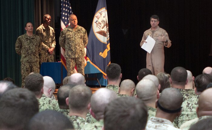 Commander of U.S. Naval Forces Central Command (COMUSNAVCENT) Vice Adm. Kevin Donegan addresses headquarters staff members on appropriate social media use aboard Naval Support Activity Bahrain, March 16. Sailors, Sodiers and Marines are advised to avoid online actions that threaten morale, operational readiness and their service core values. 