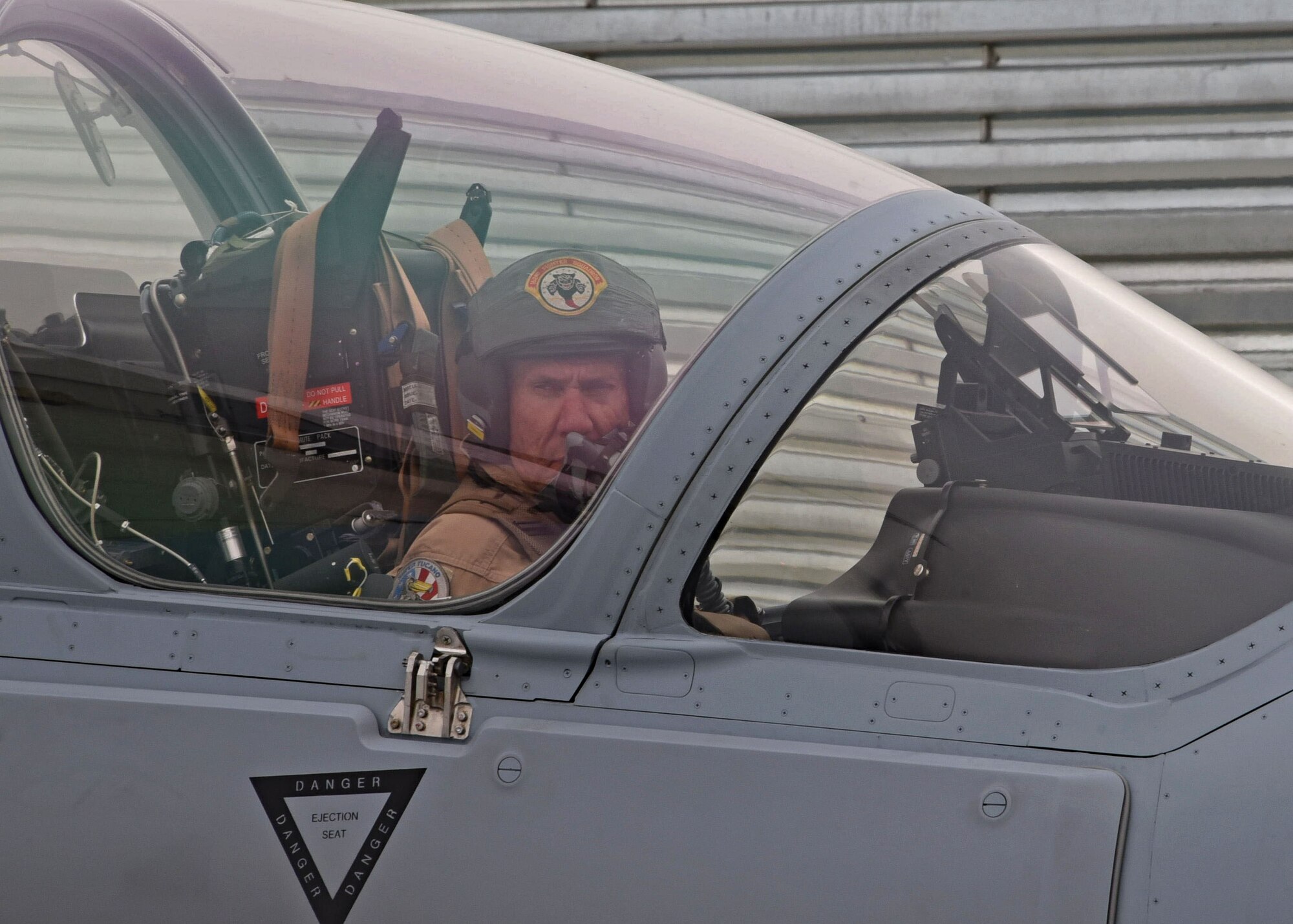 An Afghan Air Force crew chief marshals in one of four A-29 Super Tucano light-attack aircraft arriving for duty at Kabul Air Wing, Kabul, Afghanistan, March 20, 2017. The A-29s will be used by the Afghan Air Force for close-air attack, air interdiction, escort and armed reconnaissance. These latest arrivals, which traveled from Moody Air Force Base, Ga., bring the AAF A-29 inventory from eight to 12 aircraft in country. (U.S. Air Force photo by Tech. Sgt. Veronica Pierce)
