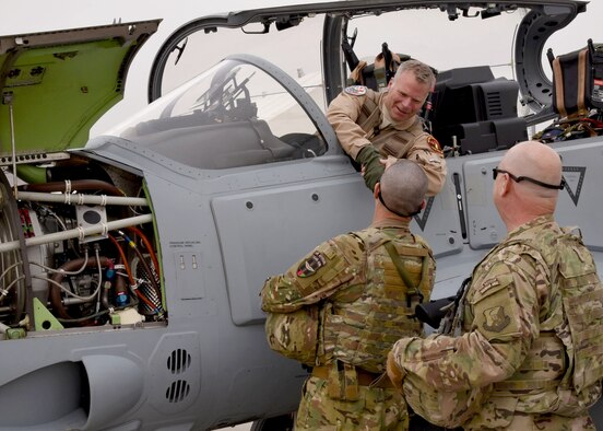 Train, Advise, Assist Command-Air advisors welcome a U.S. pilot after transporting an A-29 Super Tucano light-attack aircraft arriving for duty at Kabul Air Wing, Kabul, Afghanistan, March 20, 2017. The A-29s will be used by the Afghan Air Force for close-air attack, air interdiction, escort and armed reconnaissance. These latest arrivals, which traveled from Moody Air Force Base, Ga., bring the AAF A-29 inventory from eight to 12 aircraft in country. (U.S. Air Force photo/Tech. Sgt. Veronica Pierce)