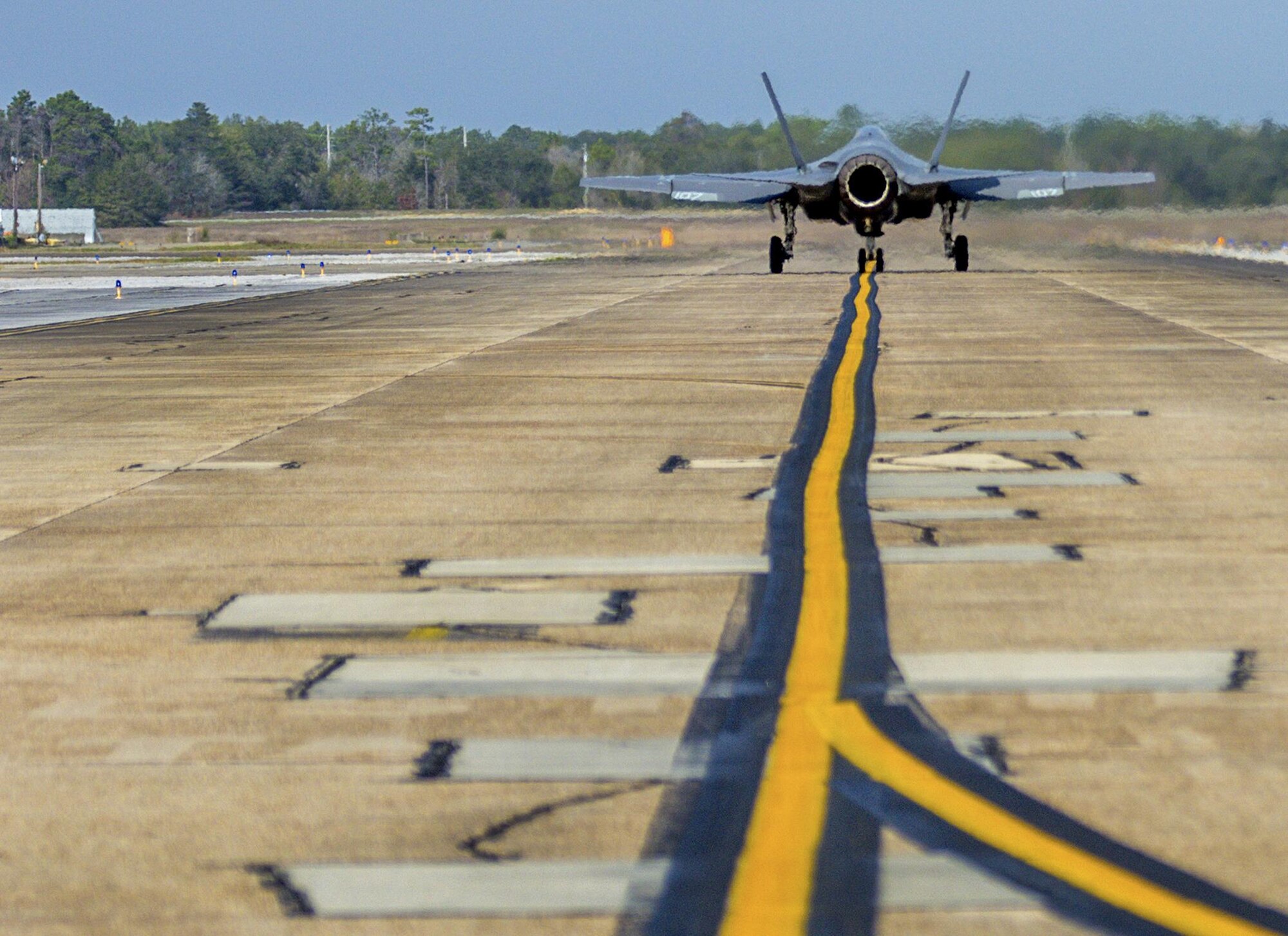 An F-35C Lightning II taxis down the flight line Feb. 27 from the F-35 Strike Fighter Squadron at Eglin Air Force Base, Fla. The F-35C variant is a carrier-capable low-observable multi-role fighter aircraft, designed to provide unmatched airborne power projection from the sea. The Navy's joint strike fighter bears structural modifications from other variants, necessitated by the increased resiliency required for carrier operations. (U.S. Air Force photo/Kristin Stewart)