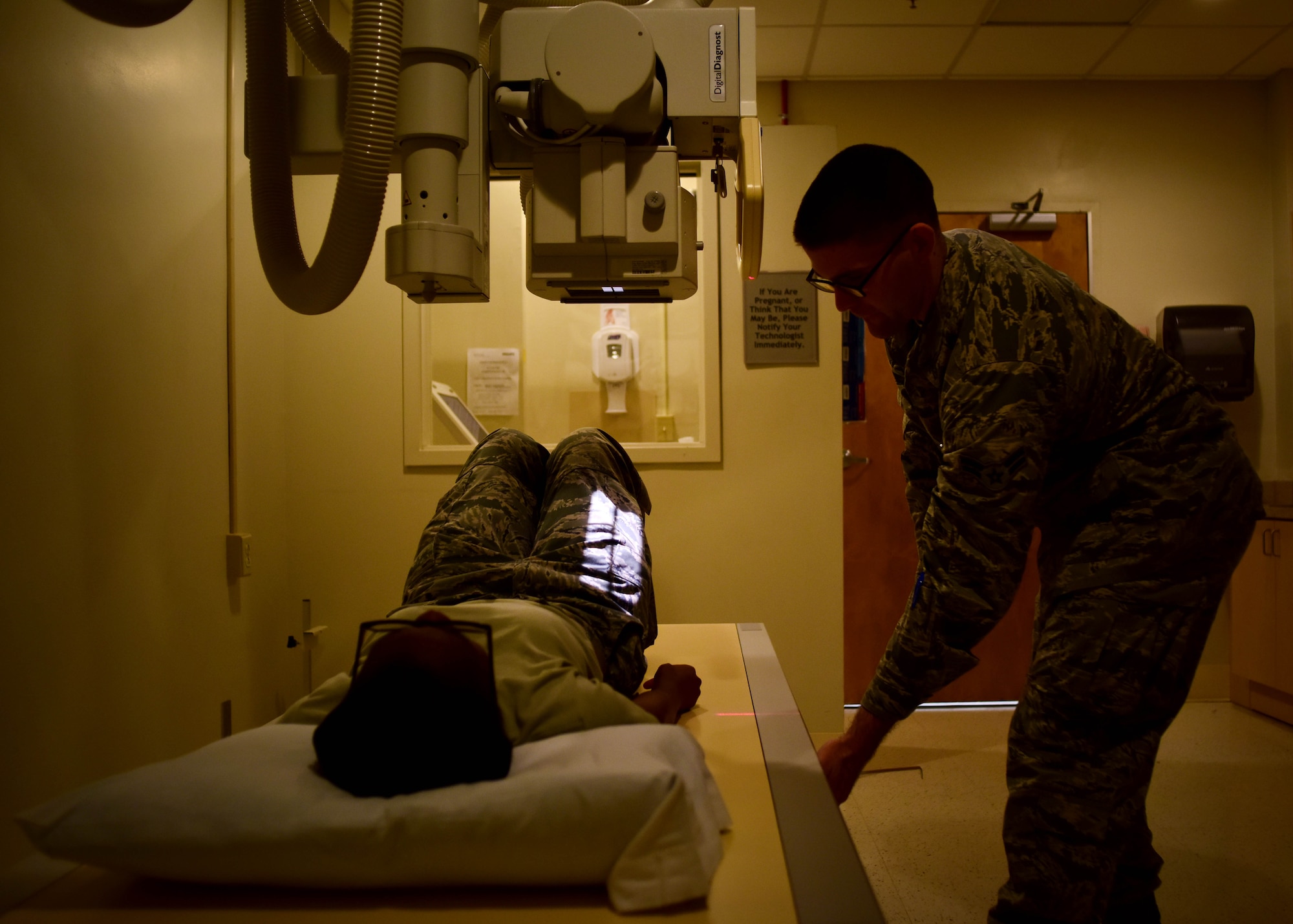 U.S. Air Force Airman 1st Class John Dennis, 633rd Surgical Operations Squadron diagnostics imaging technologist, performs an x-ray on a patient, at Joint Base Langley-Eustis, Va., Feb. 21, 2017. Airmen assigned to the 633rd SGCS radiology department are equipped with the technology needed to provide images, assisting doctors in performing diagnosis and giving trusted care to patients in the medical clinic, surgical department and emergency room, 24 hours a day.