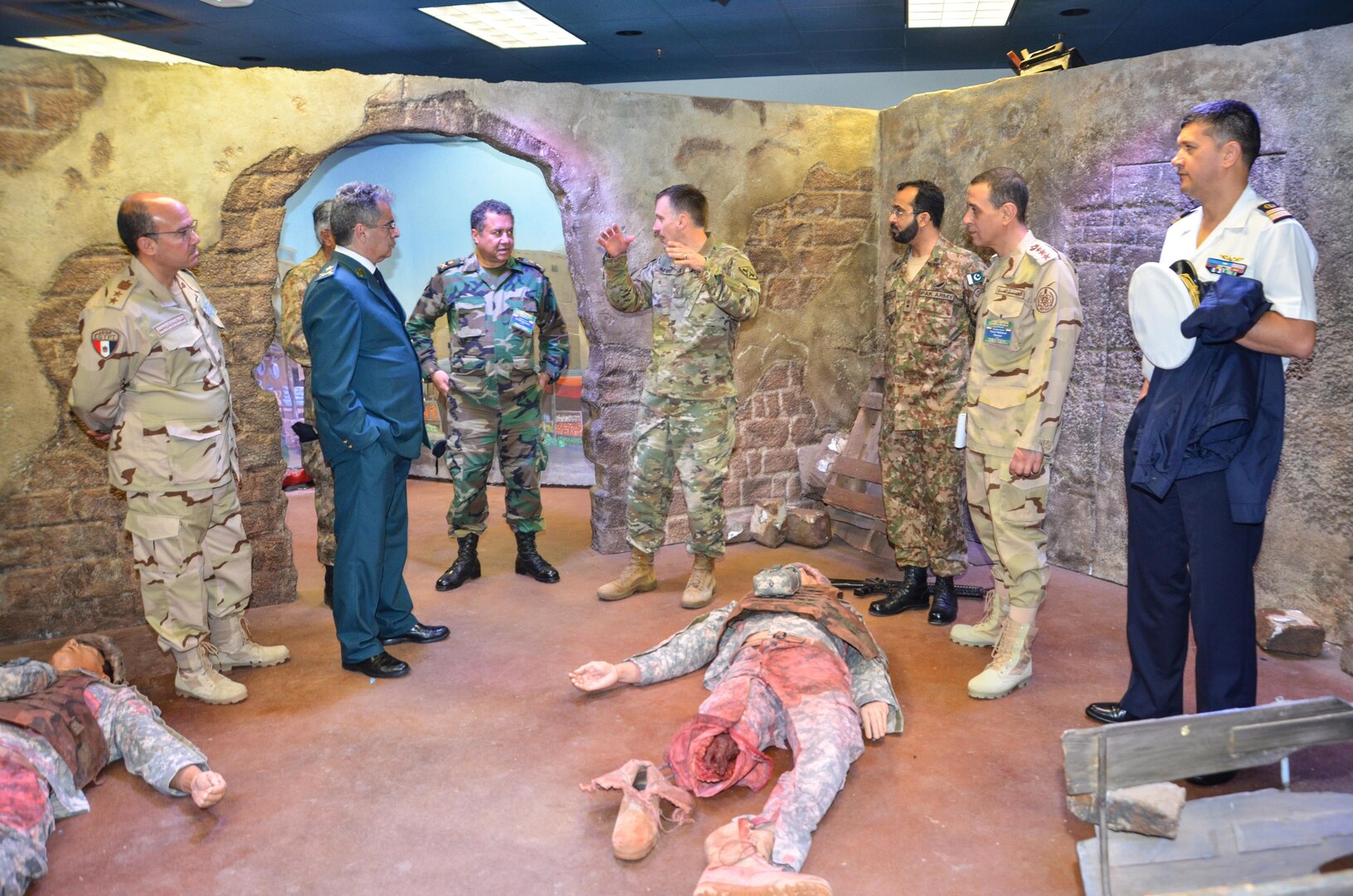 Participants in the CENTCOM Theater Medical Conference tour the Combat Trauma Patient Simulator in the Department of Combat Medic Training program at the Medical Education and Training Campus. In the CTPS, Army students apply their newly learned medical skills in a simulated combat environment. Medical professionals representing more than 10 countries within the US Central Command area of operation, Europe, and the U.S. attended the conference to aid in the continued development of capabilities that will serve to improve regional interoperability and cooperation. (Medical Education and Training Campus Public Affairs photo by Lisa Braun/Released)