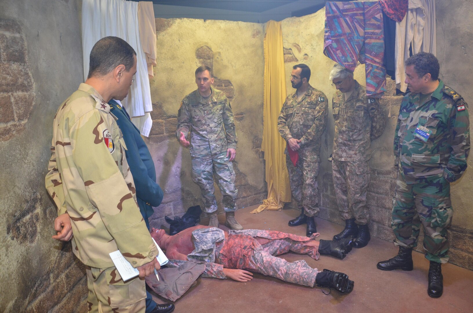 Participants in the CENTCOM Theater Medical Conference tour the Combat Trauma Patient Simulator in the Department of Combat Medic Training program at the Medical Education and Training Campus. In the CTPS, Army students apply their newly learned medical skills in a simulated combat environment. Medical professionals representing more than 10 countries within the US Central Command area of operation, Europe, and the U.S. attended the conference to aid in the continued development of capabilities that will serve to improve regional interoperability and cooperation. (Medical Education and Training Campus Public Affairs photo by Lisa Braun/Released)