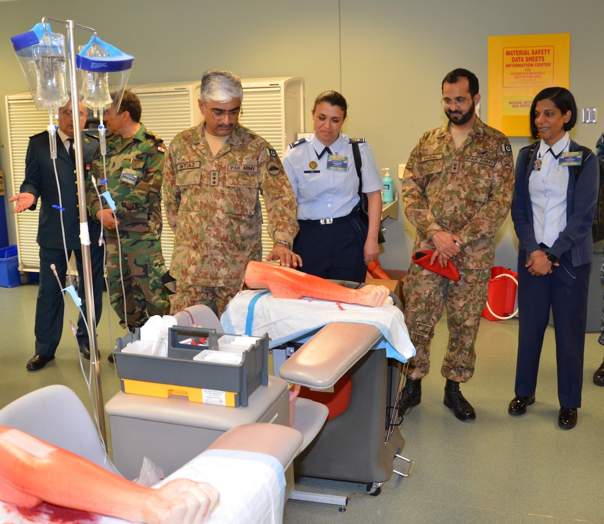 Participants in the CENTCOM Theater Medical Conference tour the “dead stick lab”, which is a laboratory used in the Basic Medical Technician Corpsman Program, where students practice intravenous (IV) and venipuncture skills on simulated arms. Medical professionals representing more than 10 countries within the US Central Command area of operation, Europe, and the U.S. attended the conference to aid in the continued development of capabilities that will serve to improve regional interoperability and cooperation. (Medical Education and Training Campus Public Affairs photo by Lisa Braun/Released)