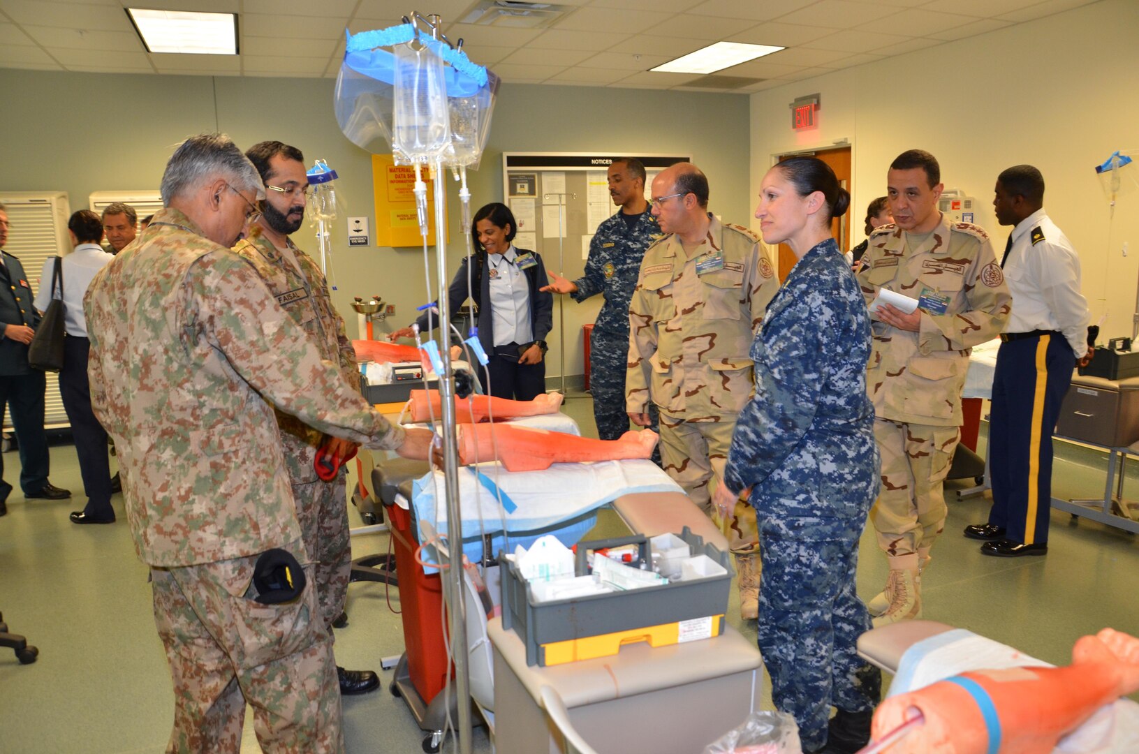 Participants in the CENTCOM Theater Medical Conference tour the “dead stick lab”, which is a laboratory used in the Basic Medical Technician Corpsman Program, where students practice intravenous (IV) and venipuncture skills on simulated arms. Medical professionals representing more than 10 countries within the US Central Command area of operation, Europe, and the U.S. attended the conference to aid in the continued development of capabilities that will serve to improve regional interoperability and cooperation. (Medical Education and Training Campus Public Affairs photo by Lisa Braun/Released)