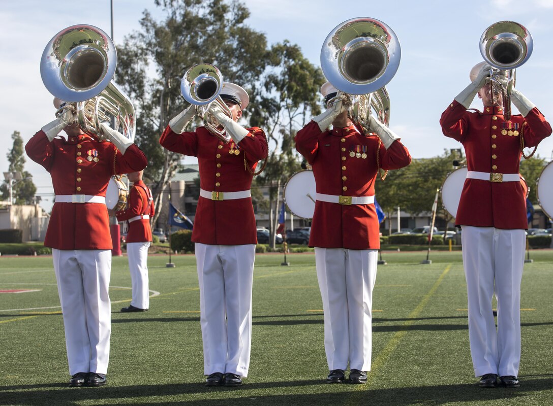 Marines with the U.S Marine Drum & Bugle Corps execute music in motion during a ceremony as a part of the U.S. Marine Corps Battle Color Detachment (BCD) performance tour aboard Marine Corps Air Station Miramar, Miramar, Ca., Mar. 10, 2017. The BCD is comprised of the Marine Corps Silent Drill Platoon, “The Commandant’s Own,” the United States Marine Drum & Bugle Corps and the Marine Corps Color Guard. The Marines of this highly skilled unit travel across the country to demonstrate the discipline, professionalism, and “Esprit de Corps” of United States Marines. (Official Marine Corps photo by Cpl. Robert Knapp/Released)