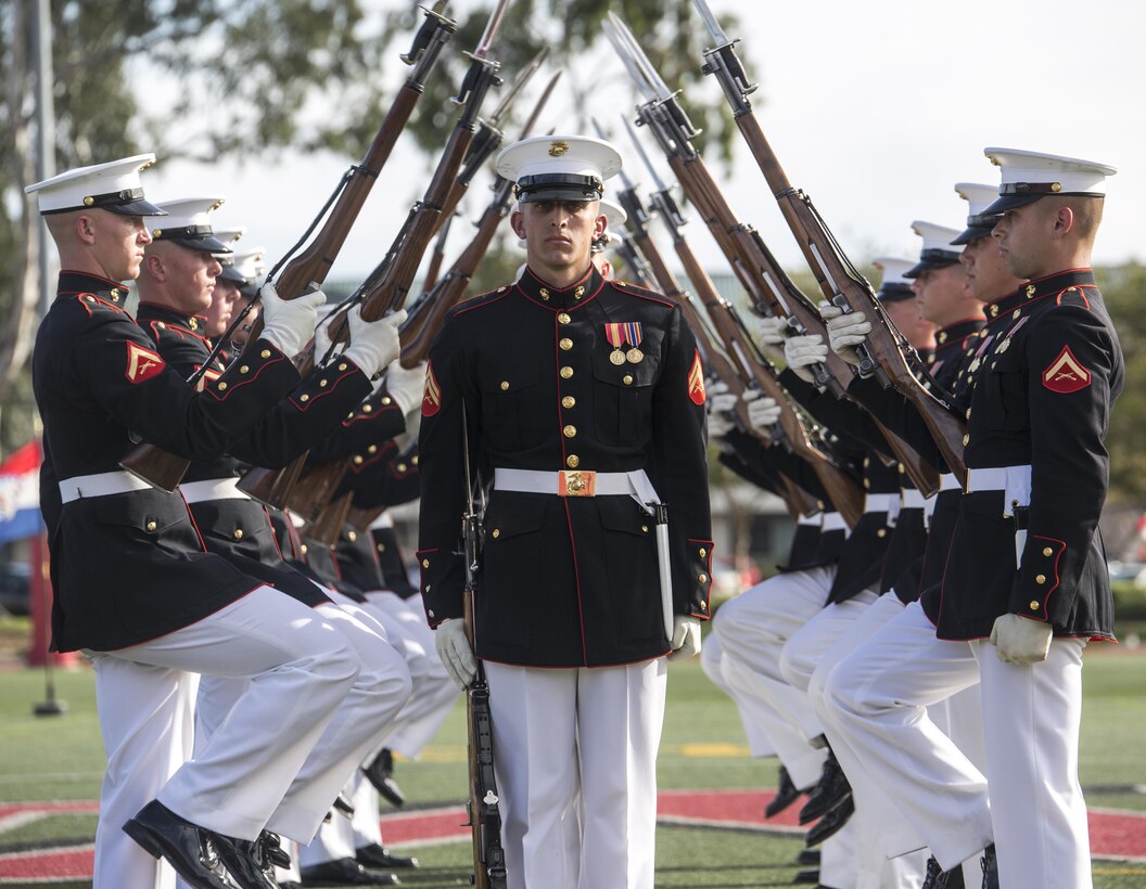 Marines with the Marine Corps Silent Drill Platoon execute precision drill movements during a ceremony as a part of the U.S. Marine Corps Battle Color Detachment (BCD) performance tour aboard Marine Corps Air Station Miramar, Miramar, Ca., Mar. 7, 2017. The BCD is comprised of the Marine Corps Silent Drill Platoon, “The Commandant’s Own,” the United States Marine Drum & Bugle Corps and the Marine Corps Color Guard. The Marines of this highly skilled unit travel across the country to demonstrate the discipline, professionalism, and “Esprit de Corps” of United States Marines.(Official Marine Corps photo by Cpl. Robert Knapp/Released)
