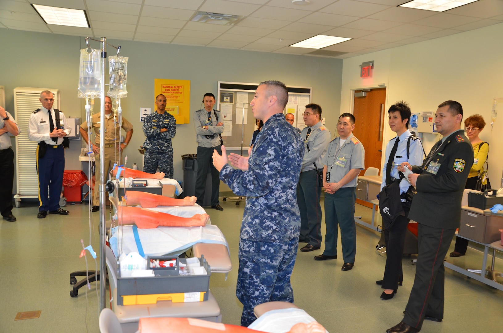 Participants in the CENTCOM Theater Medical Conference tour the “dead stick lab”, which is a laboratory used in the Basic Medical Technician Corpsman Program, where students practice intravenous (IV) and venipuncture skills on simulated arms. Medical professionals representing more than 10 countries within the US Central Command area of operation, Europe, and the U.S. attended the conference to aid in the continued development of capabilities that will serve to improve regional interoperability and cooperation. (Medical Education and Training Campus Public Affairs photo by Lisa Braun/Released)