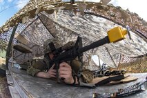 Airman 1st Class Michael Patterson, 105th Base Defense Squadron fireteam member, secures his sector of a defense fighting position during a Mission Readiness Exercise, March 8, 2017, at Avon Park Air Force Range, Fla. Airmen from the 105th BDS embedded into the 822d Base Defense Squadron to participate in the exercise. While the 822d BDS used the exercise to validate their training and regain their status as a Global Response Force, the 105th BDS received training that allowed them to show their capabilities and strengthened the bond between the two squadrons. (U.S. Air Force Photo by Airman 1st Class Janiqua P. Robinson)