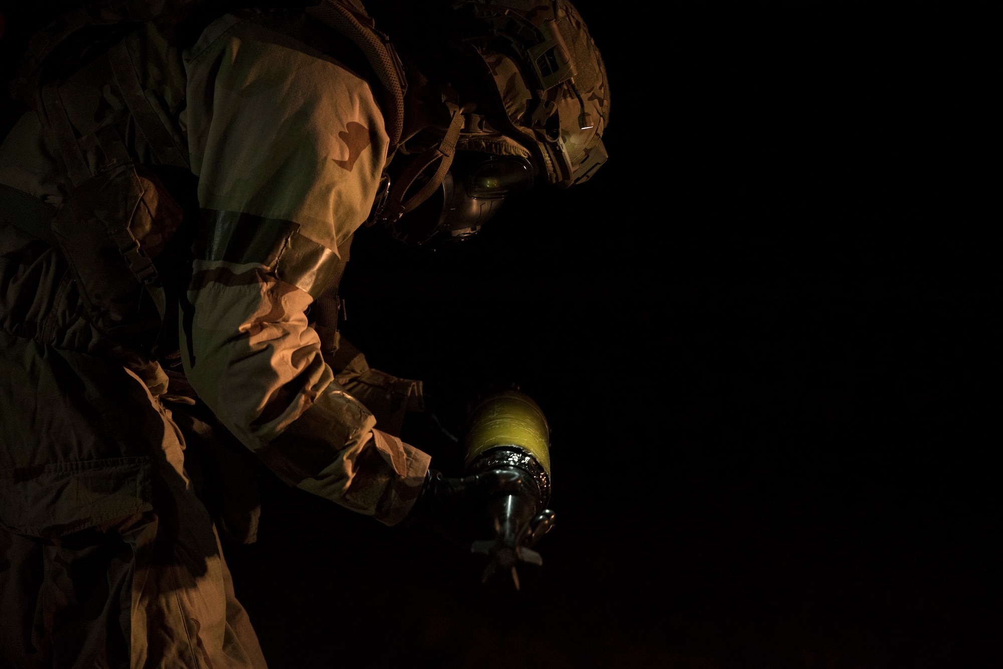 Staff Sgt. Justin Smith, 23d Civil Engineer Squadron explosive ordinance disposal flight’s NCO in charge of equipment, examines a simulated chemical bomb during a Mission Readiness Exercise, March 10, 2017, at Avon Park Air Force Range, Fla. The MRX took place March 2-13 and ensured the 822d Base Defense Squadron could efficiently deploy anywhere in the world in less than 72 hours. During the two week MRX, the squadron was evaluated on its ability to set-up a bare base, effectively thwart enemy attacks, run a secure Tactical Operation Center and maintain positive relationships with villagers in surrounding areas. (U.S. Air Force Photo by Airman 1st Class Janiqua P. Robinson)