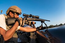 Staff Sgt. Christopher Zavala-Romero, left, and his spotter Tech. Sgt. Pablo Cancel-Torres, 822d Base Defense Squadron squad leaders, secure a sector of a defense fighting position during a Mission Readiness Exercise, March 11, 2017, at Avon Park Air Force Range, Fla. The MRX took place March 2-13 and ensured the 822d BDS could efficiently deploy anywhere in the world in less than 72 hours. During the two week MRX, the squadron was evaluated on its ability to set-up a bare base, effectively thwart enemy attacks, run a secure Tactical Operation Center and maintain positive relationships with villagers in surrounding areas. (U.S. Air Force Photo by Airman 1st Class Janiqua P. Robinson)