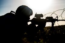 Senior Airman Al’lamar White, 822d Base Defense Squadron fireteam member, secures his sector of a defense fighting position during a Mission Readiness Exercise, March 11, 2017, at Avon Park Air Force Range, Fla. The MRX took place March 2-13 and ensured the 822d BDS could efficiently deploy anywhere in the world in less than 72 hours. During the two week MRX, the squadron was evaluated on its ability to set-up a bare base, effectively thwart enemy attacks, run a secure Tactical Operation Center and maintain positive relationships with villagers in surrounding areas. (U.S. Air Force Photo by Airman 1st Class Janiqua P. Robinson)