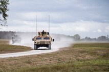 Airmen take Humvee out on patrol in response to reports of suspicious activity in a nearby village during a Mission Readiness Exercise, March 7, 2017, at Avon Park Air Force Range, Fla. The MRX took place March 2-13 and ensured the 822d Base Defense Squadron could efficiently deploy anywhere in the world in less than 72 hours. During the two week MRX, the squadron was evaluated on its ability to set-up a bare base, effectively thwart enemy attacks, run a secure Tactical Operation Center and maintain positive relationships with villagers in surrounding areas. (U.S. Air Force Photo by Airman 1st Class Janiqua P. Robinson)
