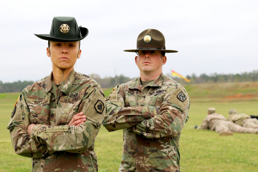 Army Reserve Staff Sgt. Briana Popp donned her drill sergeant hat during a graduation ceremony at Fort Jackson, S.C. March 8, 2017. Popp earned the titles of Iron Female and Distinguished Honor Graduate and will be a drill sergeant with the 98th Training Division (Initial Entry Training). Popp was the first female Distinguished Honor Graduate in the past six cycles and happened to graduate in March, which is Women's History Month. Coincidentally, Popp's graduation day was International Women's Day as well. Popp is married to active duty drill sergeant, Staff Sgt. Victor James Popp, Echo Company, 2-19 Infantry Battalion, 198th Infantry Brigade, at Fort Benning. (U.S. Army Reserve Photo by Maj. Michelle Lunato/released)