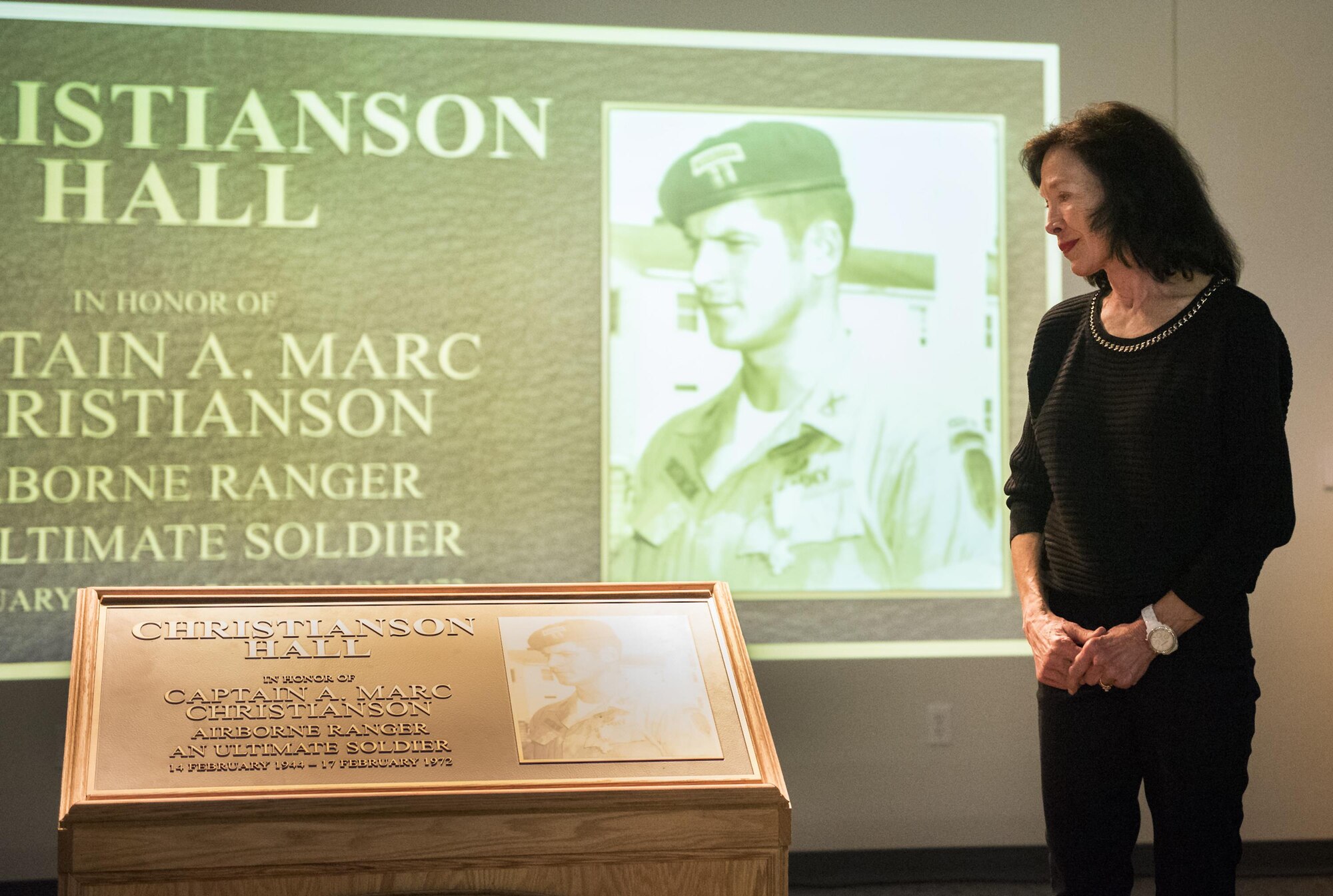 Dr. Betsy Christianson, widow of Capt. A. Marc Christianson III, admires the remembrance plaque during the 6th Ranger Training Battalion’s headquarters building dedication ceremony March 17 at Eglin Air Force Base, Fla.  The building was dedicated to Christianson, who passed away on the training range in 1972.  (U.S. Air Force photo/Samuel King Jr.)