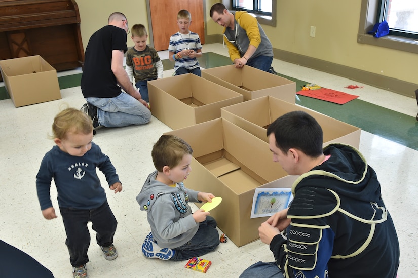 Students of the Airman Leadership School class 17-C Bravo Flight volunteer during the Airman and Family Readiness Center’s Hearts Apart Dinner at the Drive-in 2 event at the Chapel Annex here, March 14, 2017. The event gave kids the opportunity to design their own cars out of arts and craft supplies. The cars were used by the children to sit in like a drive-in while they watch a movie in a drive-in atmosphere.