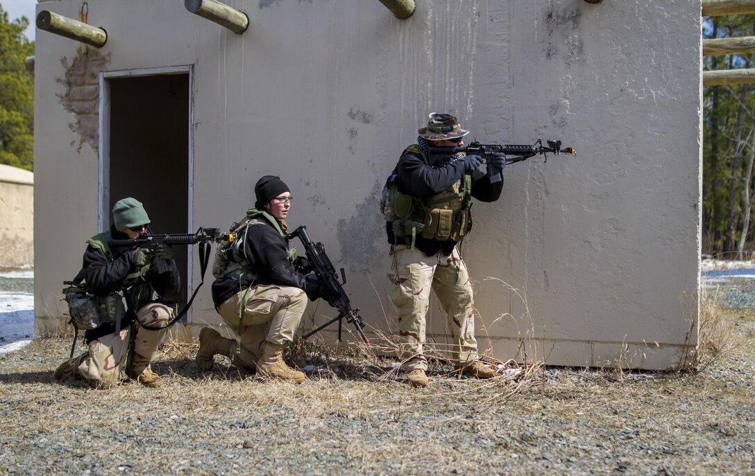 U.S. Army Reserve Soldiers assigned to the 363rd Military Police Company prepare to engage U.S. Army Soldiers assigned to the 101st Airborne Division (Air Assault) during a hasty raid at Hosteel Village near Joint base McGuire-Dix-Lakehurst on March 16, 2017, as a part of Warrior Exercise 78-17-01 which is designed to assess a units’ combat capabilities.  Army Reserve Soldiers assigned to the 363rd Military Police Company served as the oppositional force for Easy Company, 2nd Battalion, 506th Infantry Regiment, 101st Airborne Division during the exercise. Roughly 60 units from the U.S. Army Reserve, U.S. Army, U.S. Air Force, and Canadian Armed Forces are participating in the 84th Training Command’s joint training exercise, WAREX 78-17-01, at Joint Base McGuire-Dix-Lakehurst from March 8 until April 1, 2017; the WAREX is a large-scale collective training event designed to simulate real-world scenarios as America’s Army Reserve continues to build the most capable, combat-ready, and lethal Federal Reserve force in the history of the Nation. (Army Reserve Photo by Sgt. Stephanie Ramirez/ Released)