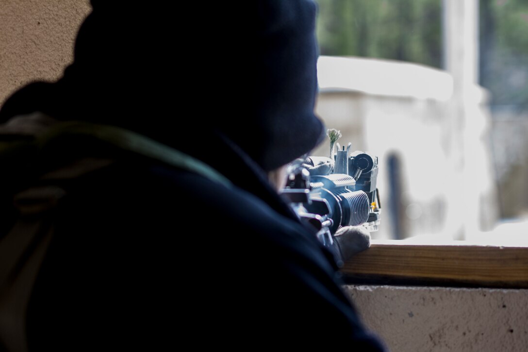 U.S. Army Reserve Soldier assigned to the 363rd Military Police Company engages U.S. Army Soldiers assigned to the 101st Airborne Division (Air Assault) during a hasty raid at Hosteel Village near Joint base McGuire-Dix-Lakehurst on March 16, 2017, as a part of Warrior Exercise 78-17-01 which is designed to assess a units’ combat capabilities.  Army Reserve Soldiers assigned to the 363rd Military Police Company served as the oppositional force for Easy Company, 2nd Battalion, 506th Infantry Regiment, 101st Airborne Division during the exercise. Roughly 60 units from the U.S. Army Reserve, U.S. Army, U.S. Air Force, and Canadian Armed Forces are participating in the 84th Training Command’s joint training exercise, WAREX 78-17-01, at Joint Base McGuire-Dix-Lakehurst from March 8 until April 1, 2017; the WAREX is a large-scale collective training event designed to simulate real-world scenarios as America’s Army Reserve continues to build the most capable, combat-ready, and lethal Federal Reserve force in the history of the Nation. (Army Reserve Photo by Sgt. Stephanie Ramirez/ Released)