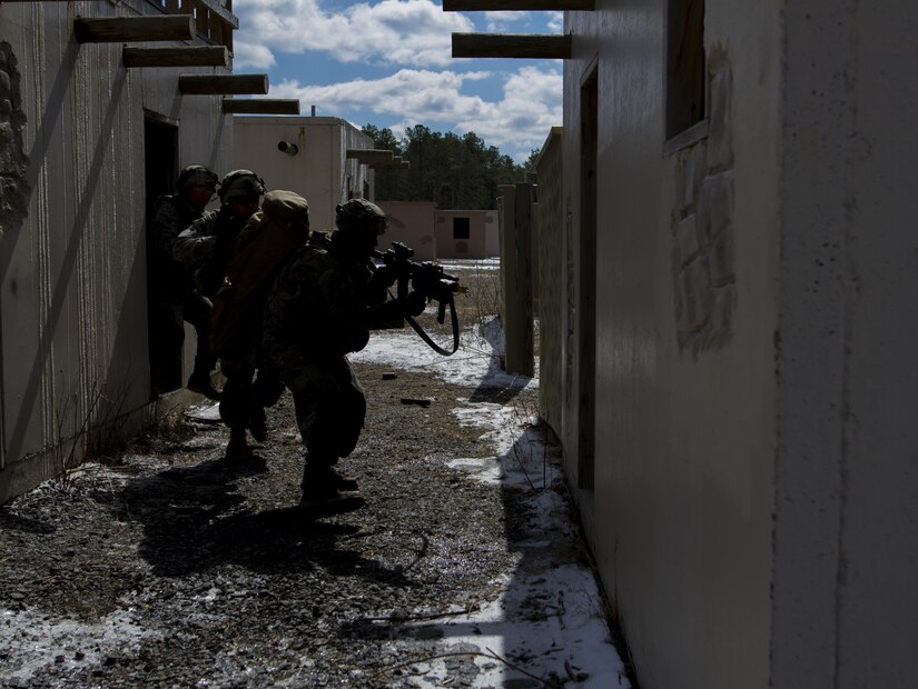 U.S. Army Soldiers assigned to Company A (Easy Company), 2nd Battalion, 506th Infantry Regiment, 101st Airborne Division (Air Assault) attack enemy forces during a hasty raid training exercise at Warrior Exercise 78-17-01 at Hosteel Village near Joint base McGuire-Dix-Lakehurst March 16, 2017. Army Reserve Soldiers assigned to the 363rd Military Police Company served as the oppositional force for Easy Company during the exercise. Easy Company kicked off WAREX 78-17-01 during a joint-component airfield seizure on March 13, 2017. Roughly 60 units from the Army Reserve, Army, Air Force, Marine Reserves, and Canadian Armed Forces participated in the 84th Training Command’s joint training exercise, WAREX 78-17-01 from March 8 to April 1, 2017; the WAREX is a large-scale collective training event designed to assess units’ combat capabilities as America’s Army Reserve continues to build the most capable, combat-ready and lethal Federal Reserve force in the history of the Nation. (Army Reserve Photo by Sgt. Stephanie Ramirez/ Released)