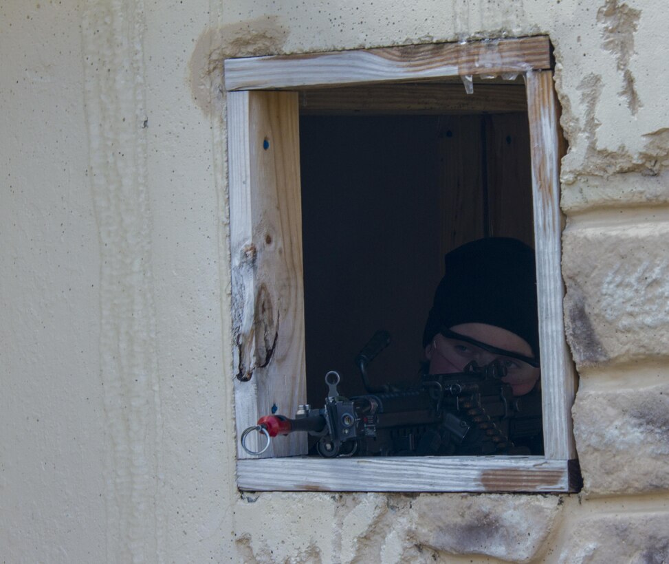 Pfc. Katelyn Harlan, a U.S. Army Reserve Soldier assigned to the 363rd Military Police Company, engages U.S. Army Soldiers assigned to the 101st Airborne Division (Air Assault) conduct a hasty raid at Hosteel Village near Joint base McGuire-Dix-Lakehurst on March 16, 2017, as a part of Warrior Exercise 78-17-01 which is designed to assess a units’ combat capabilities.  Army Reserve Soldiers assigned to the 363rd Military Police Company served as the oppositional force for Easy Company, 2nd Battalion, 506th Infantry Regiment, 101st Airborne Division during the exercise. Roughly 60 units from the U.S. Army Reserve, U.S. Army, U.S. Air Force, and Canadian Armed Forces are participating in the 84th Training Command’s joint training exercise, WAREX 78-17-01, at Joint Base McGuire-Dix-Lakehurst from March 8 until April 1, 2017; the WAREX is a large-scale collective training event designed to simulate real-world scenarios as America’s Army Reserve continues to build the most capable, combat-ready, and lethal Federal Reserve force in the history of the Nation. (Army Reserve Photo by Sgt. Stephanie Ramirez/ Released)