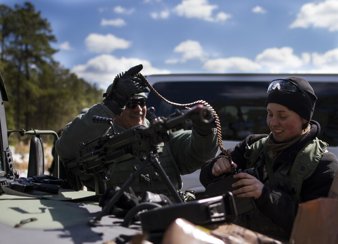 U.S. Army Reserve Soldier Master Sgt. Mike Dipetta, assigned to the 78th Training Division, helps Pfc. Katelyn Harlan, U.S. Army Reserve Soldier assigned to the 363rd Military Police Company, reload her weapon after battling U.S. Army Soldiers assigned to the 101st Airborne Division (Air Assault) during a hasty raid at Hosteel Village near Joint base McGuire-Dix-Lakehurst on March 16, 2017, as a part of Warrior Exercise 78-17-01 which is designed to assess a units’ combat capabilities.  Army Reserve Soldiers assigned to the 363rd Military Police Company served as the oppositional force for Easy Company, 2nd Battalion, 506th Infantry Regiment, 101st Airborne Division during the exercise. Roughly 60 units from the U.S. Army Reserve, U.S. Army, U.S. Air Force, and Canadian Armed Forces are participating in the 84th Training Command’s joint training exercise, WAREX 78-17-01, at Joint Base McGuire-Dix-Lakehurst from March 8 until April 1, 2017; the WAREX is a large-scale collective training event designed to simulate real-world scenarios as America’s Army Reserve continues to build the most capable, combat-ready, and lethal Federal Reserve force in the history of the Nation. (Army Reserve Photo by Sgt. Stephanie Ramirez/ Released)