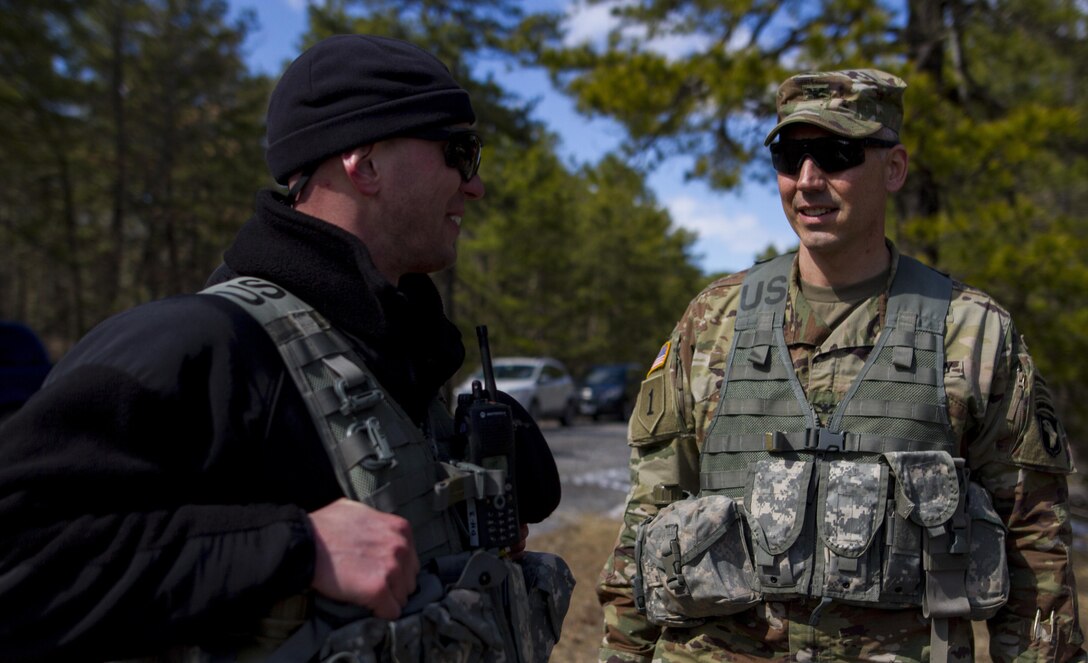 Col. Eric Lopez, the 101st Airborne Division (Air Assault) operations commander, congratulates U.S. Army Reserve 1st Lt. Nick Sanders, a platoon leader assigned to the 363rd Military Police Company, after a hasty raid at Hosteel Village near Joint base McGuire-Dix-Lakehurst on March 16, 2017, as a part of Warrior Exercise 78-17-01 which is designed to assess a units’ combat capabilities.  Army Reserve Soldiers assigned to the 363rd Military Police Company served as the oppositional force for Easy Company, 2nd Battalion, 506th Infantry Regiment, 101st Airborne Division during the exercise. Roughly 60 units from the U.S. Army Reserve, U.S. Army, U.S. Air Force, and Canadian Armed Forces are participating in the 84th Training Command’s joint training exercise, WAREX 78-17-01, at Joint Base McGuire-Dix-Lakehurst from March 8 until April 1, 2017; the WAREX is a large-scale collective training event designed to simulate real-world scenarios as America’s Army Reserve continues to build the most capable, combat-ready, and lethal Federal Reserve force in the history of the Nation. (Army Reserve Photo by Sgt. Stephanie Ramirez/ Released)