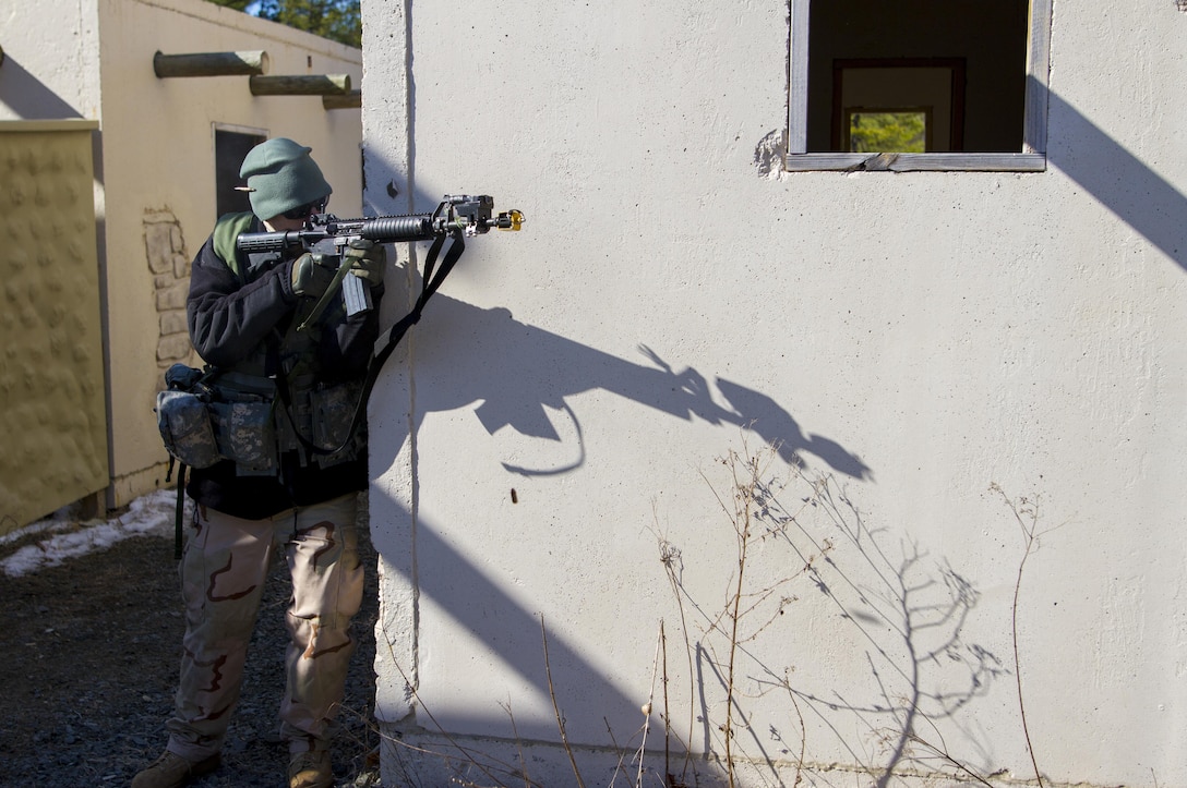 Staff Sgt. Matt Bigger, a U.S. Army Reserve Soldier assigned to the 363rd Military Police Company, engages U.S. Army Soldiers assigned to the 101st Airborne Division (Air Assault) during a hasty raid at Hosteel Village near Joint base McGuire-Dix-Lakehurst on March 16, 2017, as a part of Warrior Exercise 78-17-01 which is designed to assess a units’ combat capabilities.  Army Reserve Soldiers assigned to the 363rd Military Police Company served as the oppositional force for Easy Company, 2nd Battalion, 506th Infantry Regiment, 101st Airborne Division during the exercise. Roughly 60 units from the U.S. Army Reserve, U.S. Army, U.S. Air Force, and Canadian Armed Forces are participating in the 84th Training Command’s joint training exercise, WAREX 78-17-01, at Joint Base McGuire-Dix-Lakehurst from March 8 until April 1, 2017; the WAREX is a large-scale collective training event designed to simulate real-world scenarios as America’s Army Reserve continues to build the most capable, combat-ready, and lethal Federal Reserve force in the history of the Nation. (Army Reserve Photo by Sgt. Stephanie Ramirez/ Released)