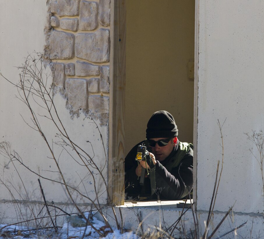 Staff Sgt. David Pisano, a U.S. Army Reserve Soldier assigned to the 363rd Military Police Company, engages U.S. Army Soldiers assigned to the 101st Airborne Division (Air Assault) during a hasty raid at Hosteel Village near Joint base McGuire-Dix-Lakehurst on March 16, 2017, as a part of Warrior Exercise 78-17-01 which is designed to assess a units’ combat capabilities.  Army Reserve Soldiers assigned to the 363rd Military Police Company served as the oppositional force for Easy Company, 2nd Battalion, 506th Infantry Regiment, 101st Airborne Division during the exercise. Roughly 60 units from the U.S. Army Reserve, U.S. Army, U.S. Air Force, and Canadian Armed Forces are participating in the 84th Training Command’s joint training exercise, WAREX 78-17-01, at Joint Base McGuire-Dix-Lakehurst from March 8 until April 1, 2017; the WAREX is a large-scale collective training event designed to simulate real-world scenarios as America’s Army Reserve continues to build the most capable, combat-ready, and lethal Federal Reserve force in the history of the Nation. (Army Reserve Photo by Sgt. Stephanie Ramirez/ Released)