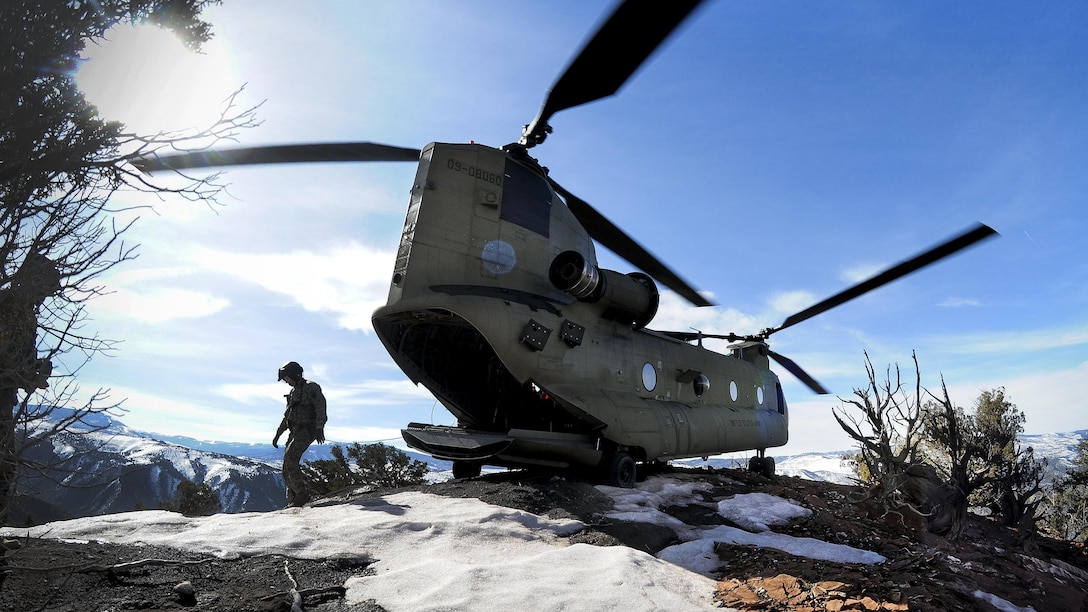 Soldiers walk around their CH-47F Chinook helicopter after landing on a mountaintop during high-altitude flight operations near Vail, Colo., March 10, 2017. The soldiers are assigned to the South Carolina Army National Guard's Company B, 2nd Battalion, 238th General Support Aviation Regiment. Army National Guard photo by Staff Sgt. Roberto Di Giovine

