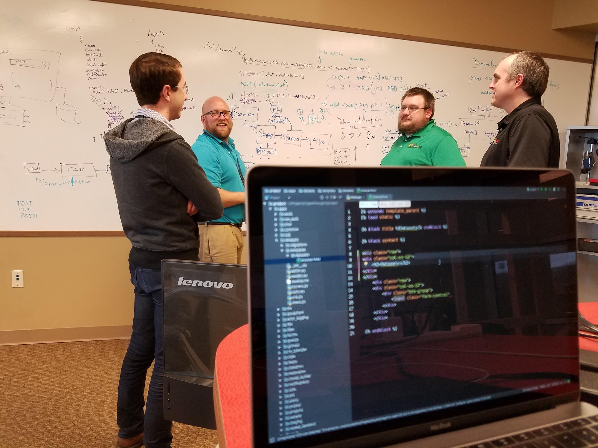 AFRL researcher Matt Jacobsen (second from left), developer of the Hyperthought data management and sharing software, strategizes with team members Kevin Porter, James Fourman, and Jason Thiese during a recent collaboration session at the AFRL Maker Hub. (U.S. Air Force photo/Holly Jordan)