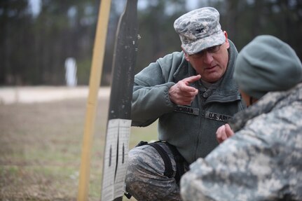 U.S. Army Col.  Shawn Cochran, 359th TTSB Brigade Commander, provides guidance to Spc. Khadijah Wilcox while attempting to zero her weapon at a qualifying range on Fort Jackson, S.C., March 18, 2017. The 982nd Combat Camera Company (Airborne) is one of only two combat camera companies in the U.S. Army tasked with providing the Office of the Secretary of Defense, Chairman of the Joint Chiefs of Staff, and the military departments with a directed imagery capability in support of operational and planning requirements through the full range of military operations. (U.S. Army Photo by SPC Kristen Dobson)
