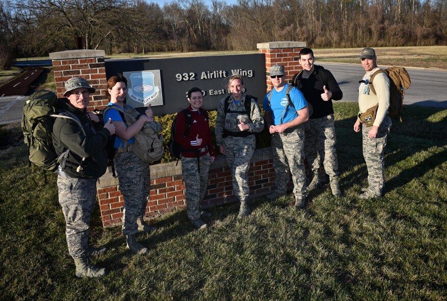 Members of the 932nd Airlift Wing walk the Scott Air Force Base perimeter track, March 3, 2017, in preparation for the Bataan Memorial Death March, held at the White Sands Missile Range in New Mexico.  The march honors the approximately 10,000 men that died during the 65 miles to confinement camps throughout the Philippines.  April 9, 2017 marks the 75th anniversary of the Bataan Death March. (U.S. Air Force photo by Tech. Sgt. Christopher Parr)