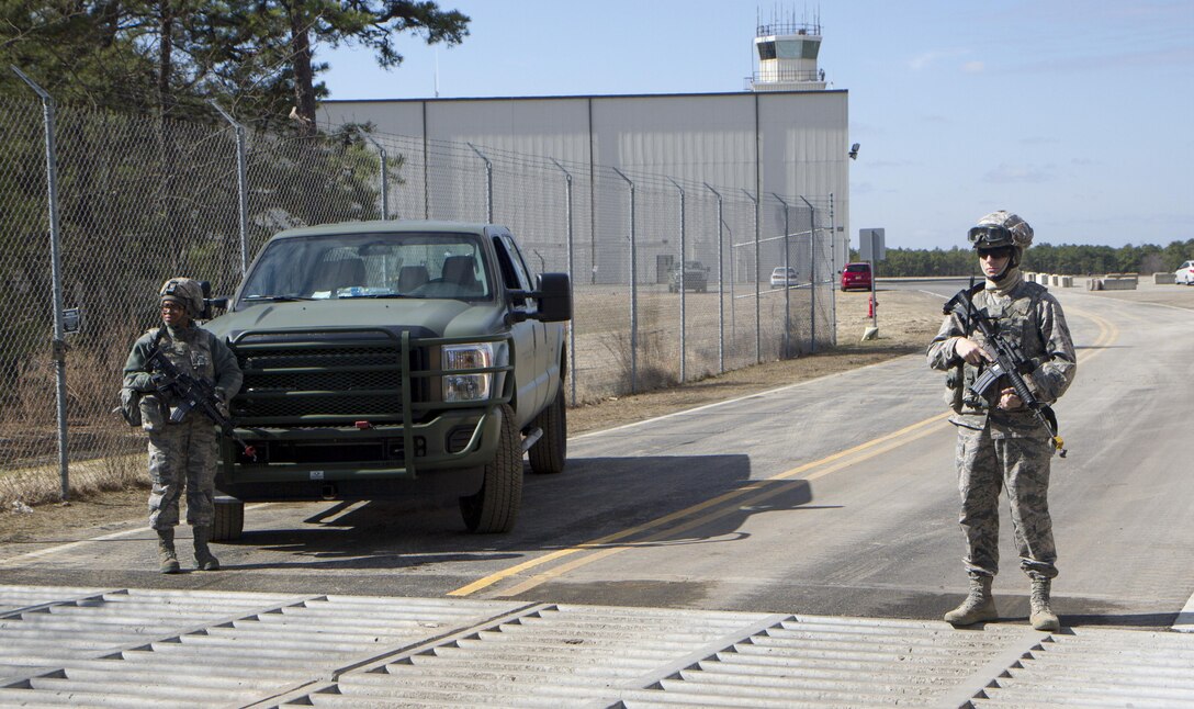 From left, Airman 1st Class Taquasia L. Fludd and Airman Drake L. Kennedy, both assigned to the 321st Contingency Response Squadron, 621st Contingency Response Wing, Joint Base McGuire-Dix-Lakehurst, N.J., provide airfield security to ensure protection of any arriving aircraft at Lakehurst Maxfield Field, N.J., Mar 19, 2017, during Warrior Exercise 78-17-01. WAREX 78-17-01 is an important step in building the most capable, combat-ready and lethal force in history. (U.S. Army Reserve photo by Staff Sgt. George F. Gutierrez, 201st Press Camp Headquarters/ Released)