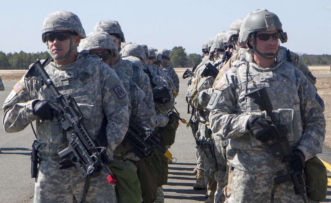 A platoon of military policemen assigned to 340th Military Police Co., 333rd Military Police Brigade, 200th Military Police Command, U.S. Army Reserve, prepare to load onto Light Medium Tactical Vehicles (LMTV) to be transported to their tactical assembly area at Lakehurst Maxfield Field, N.J., Mar 19, 2017, during Warrior Exercise 78-17-01. WAREX 78-17-01 is an important step in building the most capable, combat-ready and lethal force in history. (U.S. Army Reserve photo by Staff Sgt. George F. Gutierrez, 201st Press Camp Headquarters/ Released)