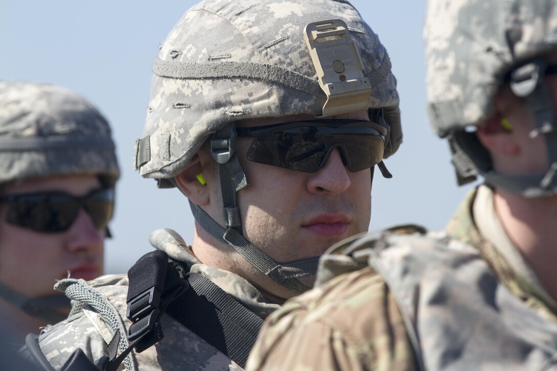 Military Policemen assigned to 340th Military Police Co., 333rd Military Police Brigade, 200th Military Police Command, U.S. Army Reserve, stand ready for onward movement to their tactical assembly area after arriving at Lakehurst Maxfield Field, N.J., Mar 19, 2017, during Warrior Exercise 78-17-01. WAREX 78-17-01 is an important step in building the most capable, combat-ready and lethal force in history. (U.S. Army Reserve photo by Staff Sgt. George F. Gutierrez, 201st Press Camp Headquarters/ Released)