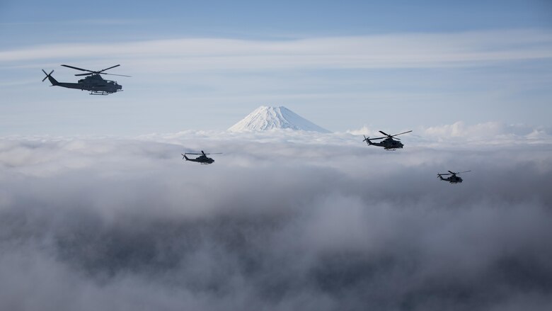 Marine Light Attack Helicopter Squadron 267 AH-1Z Viper and UH-1Y Venom helicopters past Mount Fuji, Shizuoka, Japan, March 12, 2017. The squadron, currently supporting Marine Aircraft Group 36, 1st Marine Aircraft Wing, III Marine Expeditionary Force through the unit deployment program, validated the long-range capability of auxiliary fuel tanks on their H-1 platform helicopters by flying 314 nautical miles during one leg of the four-day mission, March 10.