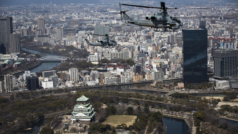 AH-1Z Vipers soar through the skies over Osaka Castle, Osaka, Japan, March 12, 2017. Marine Light Attack Helicopter Squadron 267 validated the long-range capability of the auxiliary fuel tanks on their H-1 platform helicopters by flying 314 nautical miles during one leg of the journey, March 10.