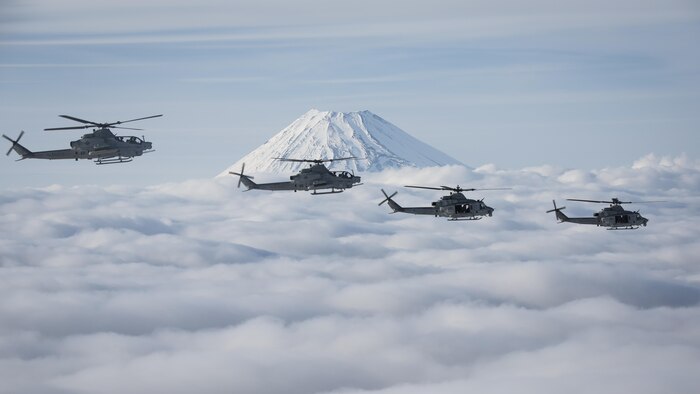 Marine Light Attack Helicopter Squadron 267 AH-1Z Viper and UH-1Y Venom helicopters past Mount Fuji, Shizuoka, Japan, March 12, 2017. The squadron, currently supporting Marine Aircraft Group 36, 1st Marine Aircraft Wing, III Marine Expeditionary Force, validated the long-range capability of auxiliary fuel tanks on their H-1 platform helicopters by flying 314 nautical miles during one leg of the four-day mission, March 10.