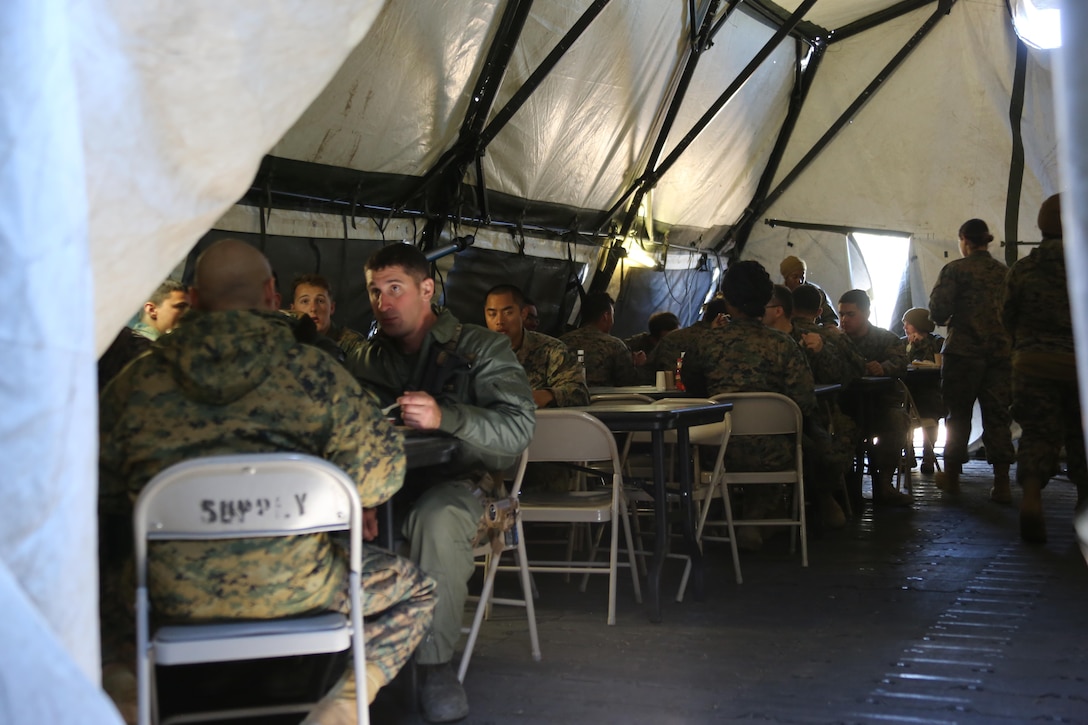 Marines assigned to Marine Wing Support Squadron 274, Marine Aircraft Group 29, 2nd Marine Aircraft Wing, enjoy a warrior’s meal aboard Marine Corps Auxiliary Landing Field Bogue, N.C., March 16, 2017. MWSS-274 senior leadership hosted the warrior meal with the United Services Organization to allow the Marines to relax before heading home as a gesture of appreciation. MWSS-274 established an air facility aboard MCALF Bogue capable of providing all airfield and air base support functions to MAG 29 squadrons with a forward arming and refueling point at Atlantic. (Marine Corps photo by Cpl. Jason Jimenez/ Released)