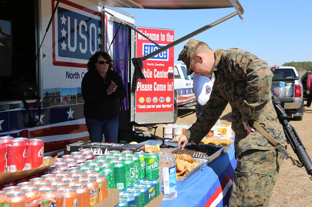 Sgt. Anthony Amers picks a cookie during a Warrior’s meal at the conclusion of Marine Wing Support Squadron 274’s field exercise aboard Marine Corps Auxiliary Landing Field Bogue, N.C., March 16, 2017. MWSS-274, Marine Aircraft Group 29, 2nd Marine Aircraft Wing senior leadership hosted the warrior meal with the United Services Organization to allow the Marines to relax before heading home as a gesture of appreciation. Amers is a bulk fuel specialist with MWSS-274. (Marine Corps photo by Cpl. Jason Jimenez/ Released)