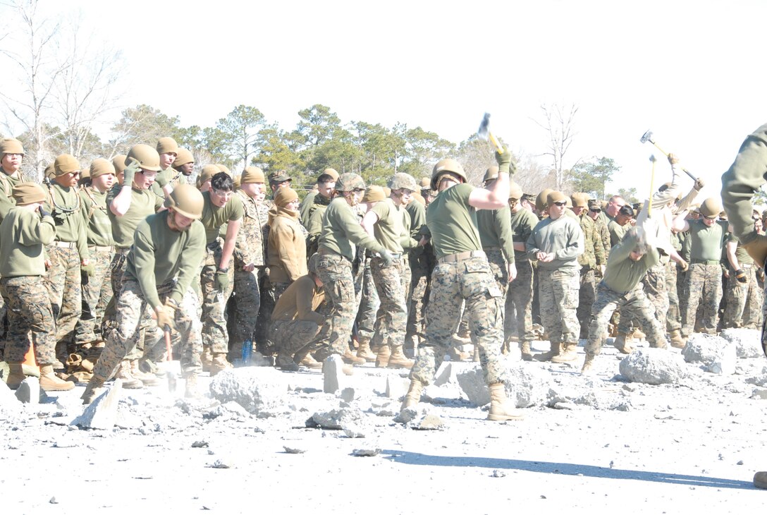 On March 16th, 2017 MCES held its annual Engineer Field Meet on Ellis Field. The annual field meet is held to celebrate the patron saint of engineers, St. Patrick; as well as build camaraderie, espirit de corps, and compete for the four-leaf clover trophy. During the Rebar Find Relay a team of Marines take turns trying to locate a piece of rebar in a cement block using only a sledgehammer.