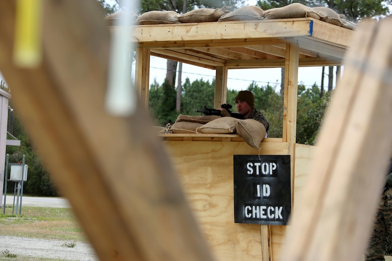 Cpl. Isaac Evans mans an entry control point during Marine Wing Support Squadron 274’s field exercise aboard Marine Corps Auxiliary Landing Field Bogue, N.C., March 10, 2017. MWSS-274, Marine Aircraft Group 29, 2nd Marine Aircraft Wing, established an air facility aboard Bogue capable of providing all airfield and air base support functions to MAG-29 squadrons with a Forward Arming and Refueling Point at Marine Corps Outlying Field Atlantic. Evans is a supply chain administration and operations specialist assigned to MWSS-274. (U.S. Marine Corps photo by Cpl. Jason Jimenez/ Released)