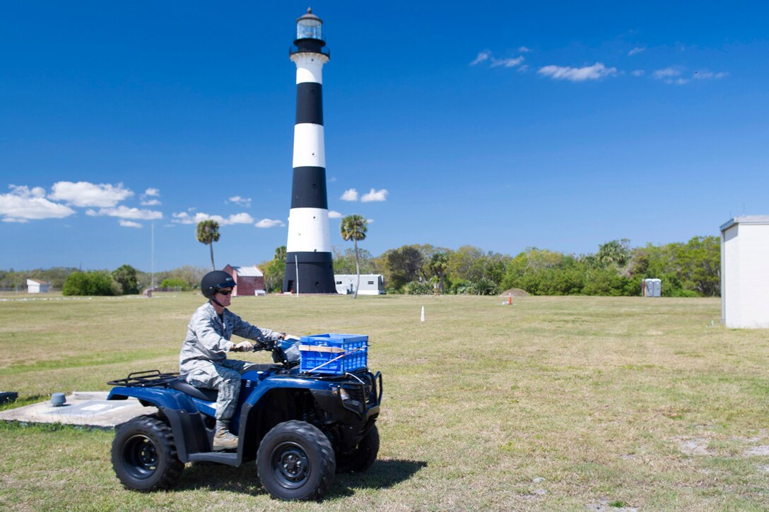 Brig. Gen. Wayne Monteith, 45th Space Wing commander, rides an All-Terrain Vehicle (ATV), during an environmental conservation immersion March 17, 2017, at Cape Canaveral Air Force Station, Fla. Prior to operating the ATV, members of the 45th Civil Engineer Squadron conducted a training session to ensure safety requirements and Personal Protective Equipment were followed.  (U.S. Air Force photo/Matthew Jurgens) 