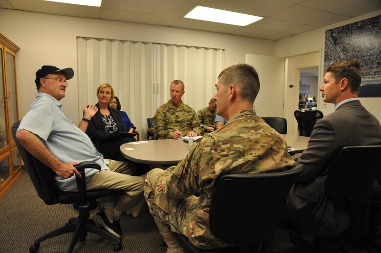 Jim Wood (left), Oceanside's mayor, and Deanna Lorson, the assistant city manager, meet with Col. Kirk Gibbs (opposite), Col. Peter Helmlinger and David Van Dorpe at the city of Oceanside Harbor Office on March 15 to discuss the upcoming annual harbor maintenance project scheduled to start in April. The contract calls for the removal of 280,000 cubic yards of sand from the harbor's entrance channel and its placement south along Oceanside's beach.