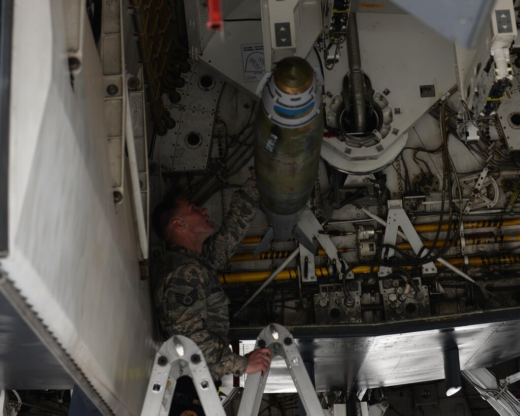 Staff Sgt. Nicholas Aitchison, a weapons load crew member assigned to the 37th Aircraft Maintenance Unit, verifies the installation of a Mark 82 General Purpose bomb during a B-1 bomber load competition at Ellsworth Air Force Base, S.D., March 17, 2017. During the load competition, the 34th and 37th AMUs showcased their skills by racing against time to load explosives on a B-1 bomber accurately and safely. (U.S. Air Force photo by Airman Nicolas Z. Erwin)