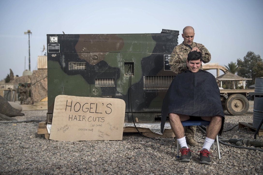 Army 1st Lt. Christopher McKinley receives a haircut from Sgt. Jeremy Hogel at an undisclosed location, March 12, 2017. McKinley and Hogel are assigned to the 82nd Airborne Division's 2nd Battalion, 325th Airborne Infantry Regiment, 2nd Brigade Combat Team. They also are deployed to support Combined Joint Task Force Operation Inherent Resolve, the global coalition to defeat the Islamic State in Iraq and Syria. Army photo by Staff Sgt. Alex Manne