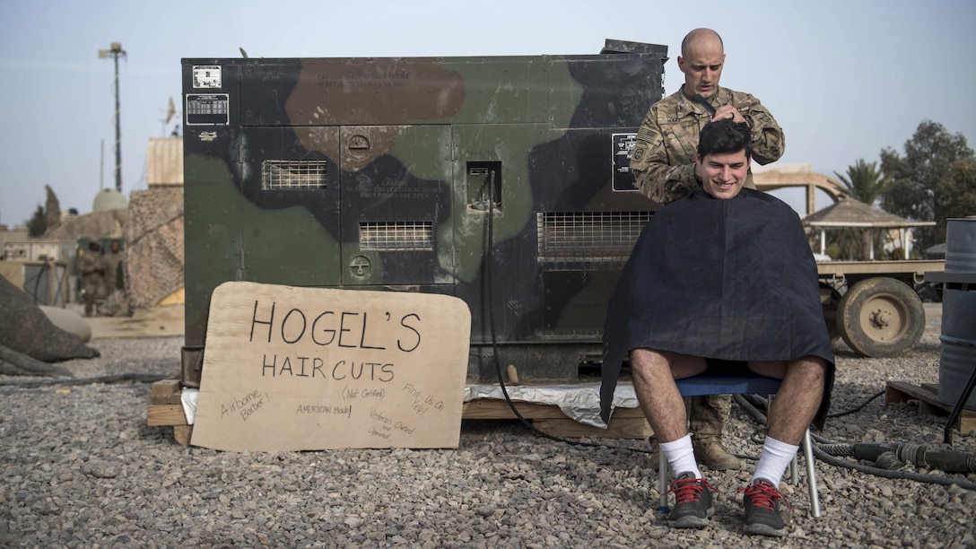 Army 1st Lt. Christopher McKinley receives a haircut from Sgt. Jeremy Hogel at an undisclosed location, March 12, 2017. McKinley and Hogel are assigned to the 82nd Airborne Division's 2nd Battalion, 325th Airborne Infantry Regiment, 2nd Brigade Combat Team. They also are deployed to support Combined Joint Task Force Operation Inherent Resolve, the global coalition to defeat the Islamic State in Iraq and Syria. Army photo by Staff Sgt. Alex Manne