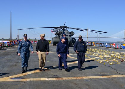 U.S. Navy amphibious dock landing ship USS Whidbey Island (LSD 41) visited Charleston, South Carolina over St. Patrick’s day weekend. Lieutenant David Pagan gives a tour of ship USS Whidbey Island to U.S. Air Force Col. Richard Mathews, commander, 628th Mission Support Group, Lt. Col. Matthew Brennan, commander, 628th Civil Engineer Squadron, and Navy Cmdr. William Edenbeck, Naval Support Activity Charleston’s Executive Officer. The Whidbey Island moored at Union Pier Terminal in downtown Charleston.
