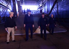U.S. Navy Lt. David Pagan, center right, gives a tour to U.S. Air Force Col. Rick Mathews, right, 628th Mission Support Group commander, U.S. Air Force Lt. Col. Matthew Brennan,center left, 628th Civil Engineer Squadron commander, and U.S. Navy Cmdr. William Edenbeck, left, Naval Support Activity Charleston executive officer, aboard the USS Whidbey Island (LSD 41) at Union the Pier Terminal March 16, 2017. U.S. Navy amphibious dock landing ship USS Whidbey Island (LSD 41) visited Charleston, South Carolina over St. Patrick’s Day Weekend. 