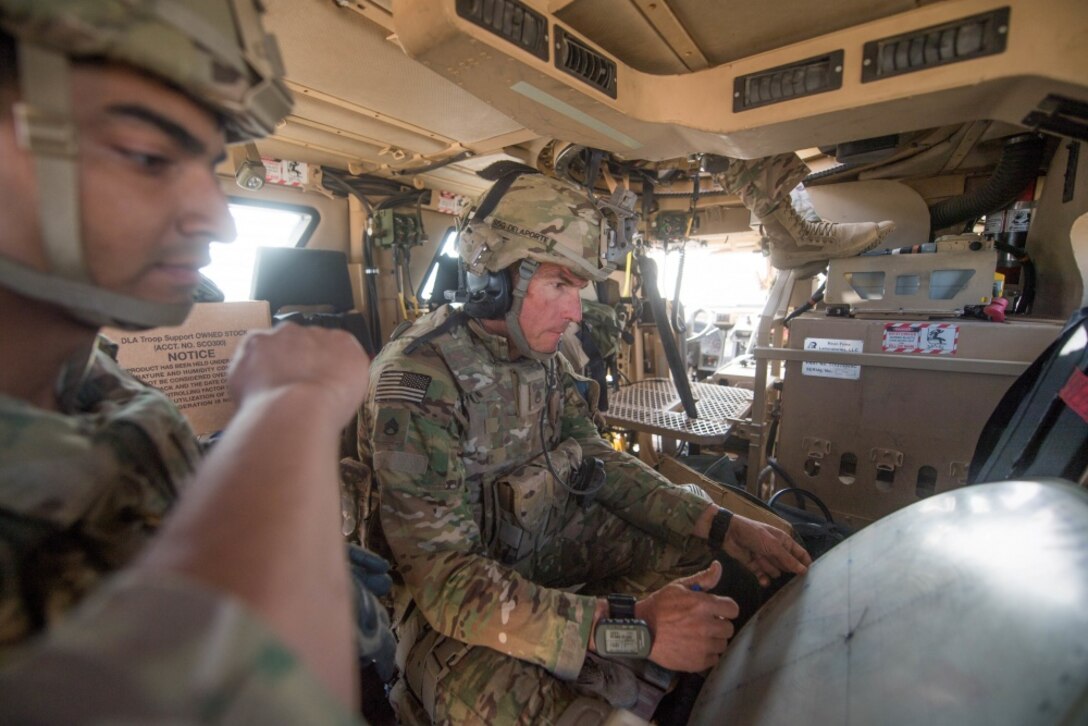 Army Staff Sgt. Bobby Delaporte, right, and Sgt. Enrique Velazquez, both assigned to the 2nd Battalion, 325th Infantry Regiment, use a plotting board to plot targets while occupying a mortar fire position near Mosul, Iraq, Feb. 28, 2017. Army photo by Staff Sgt. Alex Manne